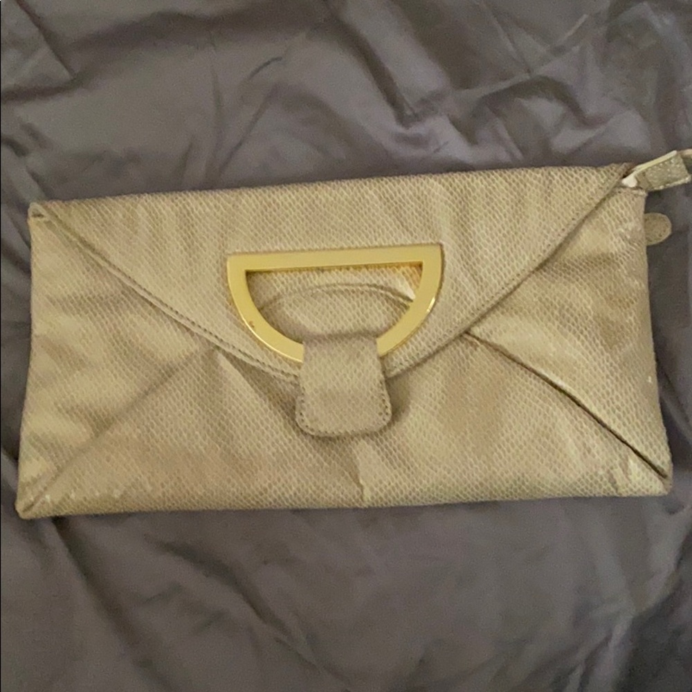 Beautiful faux snakeskin clutch. Never used